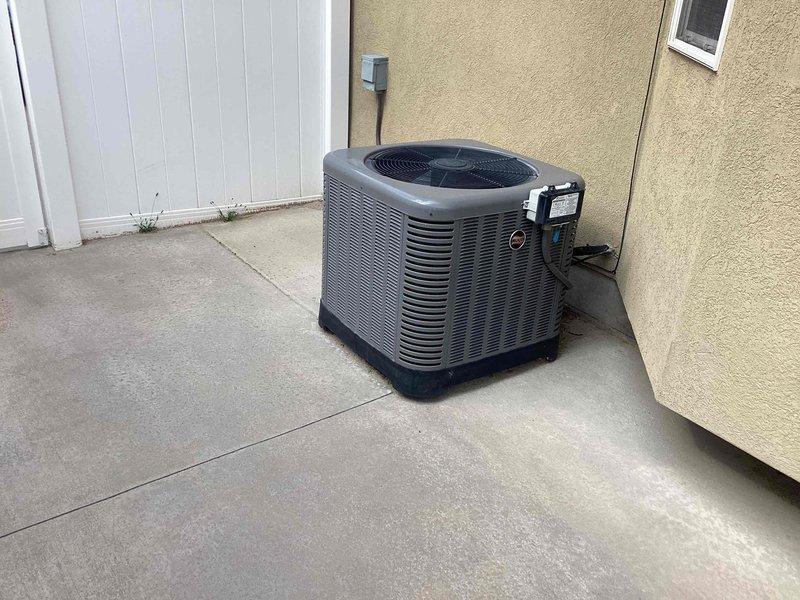 Conducted comprehensive in-home estimate for furnace replacement on original equipment installed in 2005, now over 20 years old and located in basement. Evaluated existing system operational status, assessed ductwork compatibility for new equipment installation, and discussed load calculation requirements to ensure proper sizing. Reviewed permit requirements, available warranty options, financing programs, and maintenance plan offerings. Inspected outdoor air conditioning condenser unit positioned on concrete pad against exterior wall, confirming good working condition with no visible damage or deterioration. Documented equipment placement, electrical connections, and refrigerant line routing. Provided detailed information on installation timeline, current promotional offerings, and complete system replacement options to facilitate informed decision-making for homeowner.