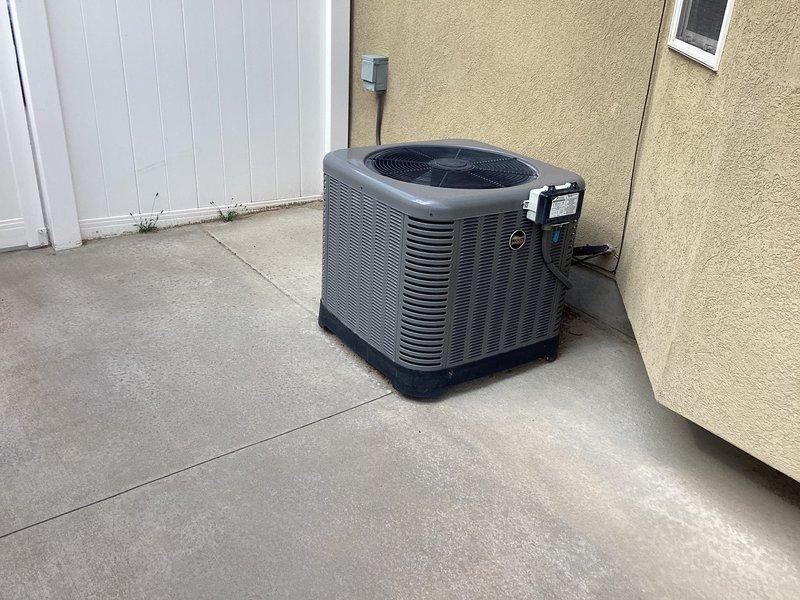 Conducted comprehensive in-home estimate for furnace replacement on original equipment installed in 2005, now over 20 years old and located in basement. Evaluated existing system operational status, assessed ductwork compatibility for new equipment installation, and discussed load calculation requirements to ensure proper sizing. Reviewed permit requirements, available warranty options, financing programs, and maintenance plan offerings. Inspected outdoor air conditioning condenser unit positioned on concrete pad against exterior wall, confirming good working condition with no visible damage or deterioration. Documented equipment placement, electrical connections, and refrigerant line routing. Provided detailed information on installation timeline, current promotional offerings, and complete system replacement options to facilitate informed decision-making for homeowner.