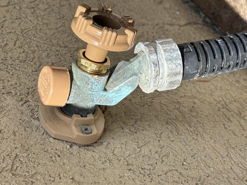 Completed annual plumbing maintenance inspection as part of Green Shield membership, including system pressure test, water purity test, and water heater flush in garage closet location. Inspected plumbing fixtures and shut-off valve assemblies, noting significant green patina and corrosion on bronze valve body with plastic fittings and flexible metal conduit connections. All scheduled maintenance tasks performed and system components documented photographically for record.
