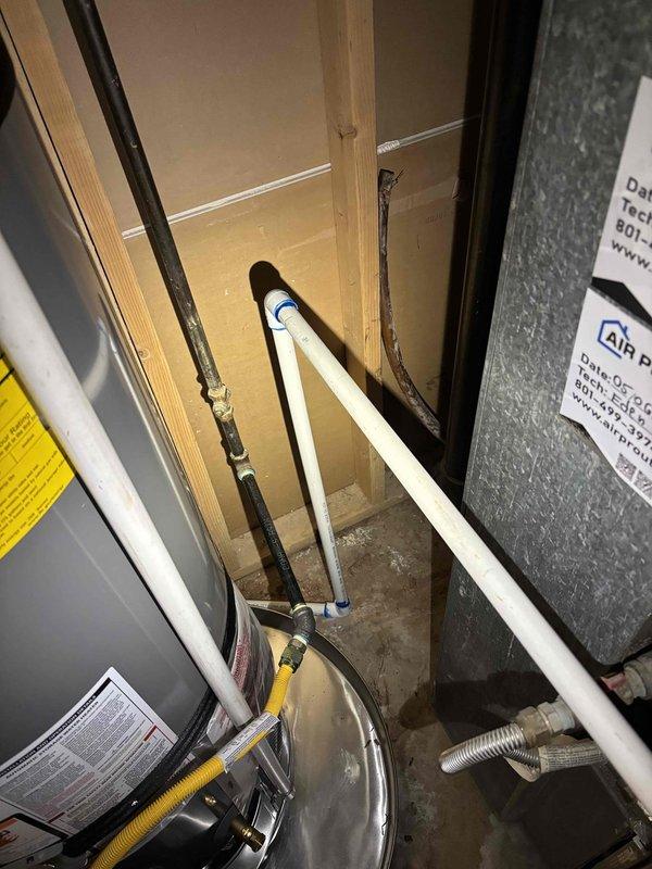 Responded to service call for AC condensate drain issue with water pooling around exterior PVC drainage line. Inspected HVAC air handler unit and associated condensate drainage system in mechanical closet, locating primary and secondary drain lines. Cleared obstruction from condensate drain line using appropriate drain cleaning methods, restoring proper drainage flow from the 4-5 year old AC system and eliminating water accumulation at exterior discharge point.