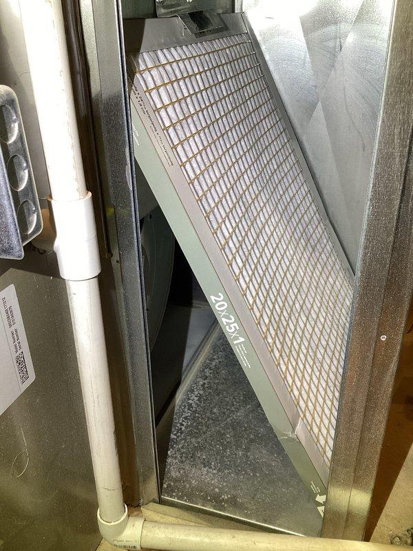 Responded to service call for frozen AC line. Upon inspection, found ice buildup on refrigerant lines connected to the air handler unit. Replaced dirty 20x25x1 air filter which was restricting airflow and causing coil to freeze. Verified proper airflow through system, checked refrigerant levels, and confirmed all components of Carrier furnace and A-coil assembly were operating within normal parameters. System returned to normal cooling operation with no further ice formation detected.