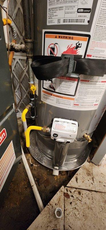 Installed a new 40-gallon residential water heater with full code compliance upgrades. Established new water and gas connections with shut-off valves and flexible supply lines. Positioned unit in drain pan with piping to floor drain for leak containment. Installed seismic restraint strapping and mounted new thermal expansion tank pressurized to match existing house water pressure. Completed all required municipal inspections and permit documentation.