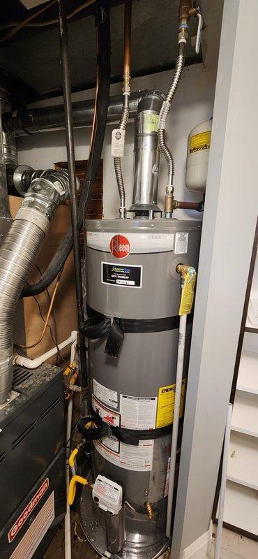 Installed a new 40-gallon residential water heater with full code compliance upgrades. Established new water and gas connections with shut-off valves and flexible supply lines. Positioned unit in drain pan with piping to floor drain for leak containment. Installed seismic restraint strapping and mounted new thermal expansion tank pressurized to match existing house water pressure. Completed all required municipal inspections and permit documentation.