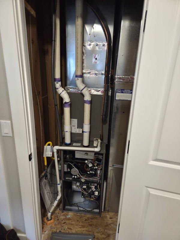 Completed dual furnace replacement installation at residential property. Basement system: installed EL297UH070XV36BK 90% efficiency furnace, upgraded PVC venting from 2" to 3" with two-pipe configuration, replaced existing 20x25x5 media cabinet with new 20x25 cabinet and MERV 11 filter, added bypass humidifier with 6" piping and necessary elbows, reused existing thermostat. Upstairs closet system: installed ML296UH045XV36BK 90% efficiency furnace with 2" two-pipe PVC venting, added new 16x25 filter rack with filter, reused existing thermostat. Both installations verified operational with proper venting, filtration, and humidification systems functioning as designed.