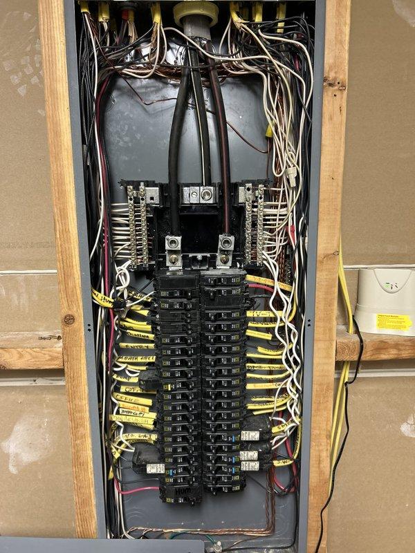 Completed comprehensive electrical maintenance inspection as part of recurring membership service. Performed thorough examination of main electrical panel, inspecting all circuit breakers, bus bars, and wire connections for proper operation and safety compliance. Verified integrity of approximately 20-30 branch circuit breakers across dual columns, examined main breaker assembly, and assessed all wire terminations including black, white, red, and yellow conductors. Documented panel condition through photography showing organized breaker arrangement and proper wire routing from service entrance through distribution points.