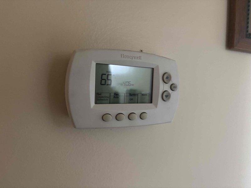 Responded to a no-heat callback on a basement furnace that cycled on briefly and shut down without producing warm air following a recent AC installation. Inspected the Honeywell thermostat (found set to System Off, Fan Auto, 65°F indoor reading) and the Lennox control module and low-voltage wiring at the furnace cabinet, verifying power indication and wiring connections. Reviewed findings and system operation to confirm proper thermostat configuration and control circuit condition.