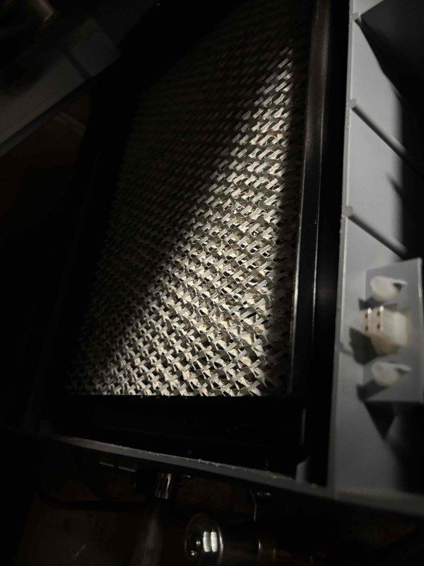 Responded to a no-heat complaint on a 4-year-old gas furnace that was circulating air at 63°F without producing warm air. Inspected the burner compartment and confirmed the burners ignited with a steady blue flame, then checked the flame sensor, limit switches, pressure switches, tubing, and wiring connections, finding no visible damage, corrosion, or loose terminals. Also inspected the humidifier pad and housing, which showed no frost, ice, or heavy rust.