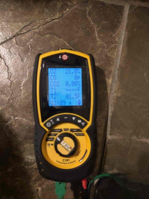 Performed seasonal tune-ups on two basement furnaces, including combustion analysis with a flue gas analyzer and visual inspection of the evaporator coil using a borescope camera, which showed clean coil surfaces with no frost, rust, or visible damage. Drain line repair on one unit had already been completed by the customer prior to the visit, and both systems were left operating normally.