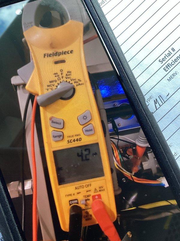 Performed annual furnace tune-ups on two 3-year-old units, both covered under the membership plan, with no issues reported. Inspected and cleaned the blower assemblies, removing dust buildup from the blower wheel and housing. Tested electrical components with a true RMS clamp meter and recorded system data, including serial numbers, filter MERV rating, and return air and room temperature readings. Both systems checked out and were left in proper operating condition.