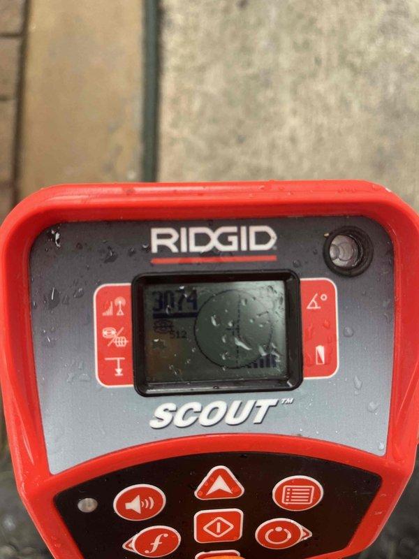 Responded to a recall for recurring basement drain backups, with wastewater slowly rising throughout the lower level approximately two weeks after the prior service. Used a RIDGID SCOUT locator in wet conditions along the exterior walkway to trace and pinpoint the underground drain line path for further evaluation. Findings were documented with photos, and the recall is being reviewed with the team to coordinate next steps for corrective repair.