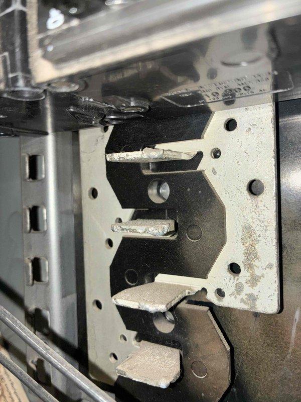 Performed an electrical maintenance inspection of the exterior main service panel, which includes a 150A main breaker and a PV system backfeed breaker with required solar labeling. Documented significant rust and corrosion on the enclosure interior, along with debris and cobweb buildup, and noted oxidation and crusty residue on the bus stab contacts. These conditions indicate moisture intrusion and potential connection degradation, and further evaluation or corrective repair of the panel is recommended.