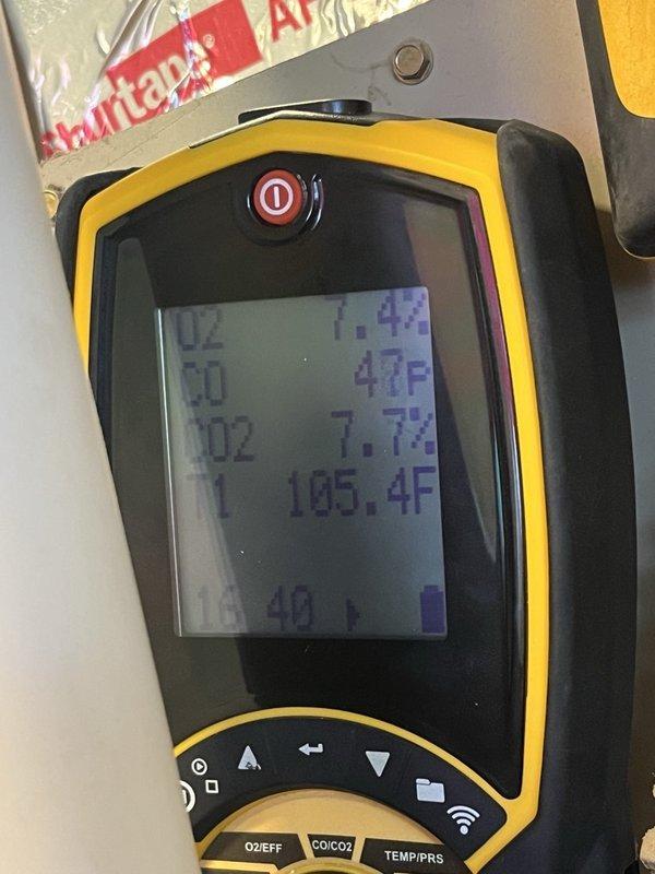 Performed a heating diagnostic on a partially operational gas furnace and conducted a combustion analysis, which recorded O2 at 7.4%, CO at 47 ppm, CO2 at 7.7%, and a flue gas temperature of 105.4°F. Inspection revealed a heavily corroded flame sensor rod with rust and pitting, indicating it requires cleaning or replacement to restore proper flame sensing and reliable furnace operation.