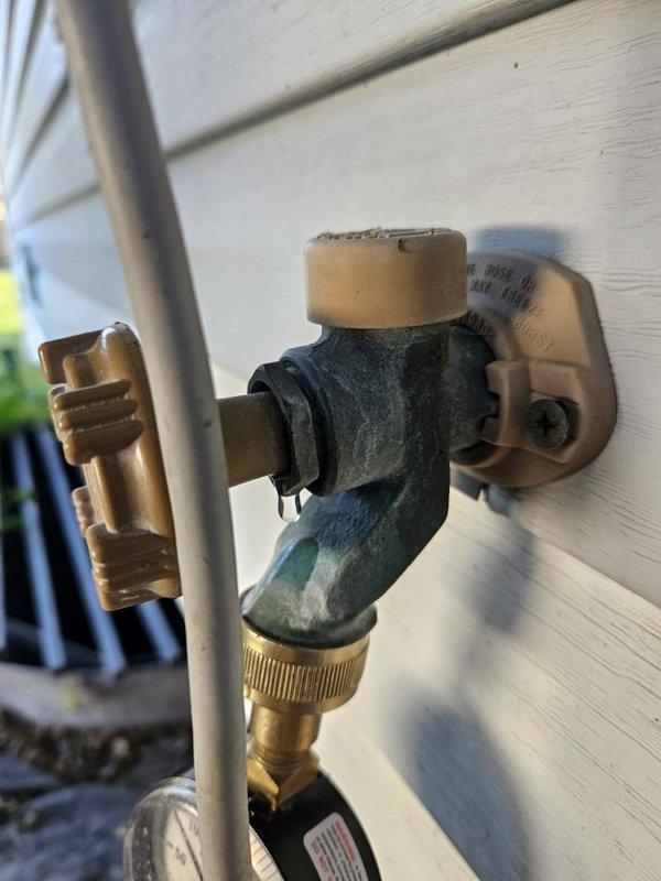 Performed annual plumbing maintenance inspection, including a system pressure test using a gauge at the exterior hose bibb and a water purity test. Flushed the gas water heater through the tank drain valve to remove sediment and verified the gas control assembly and connections were intact. Noted a minor drip at the hose bibb packing nut, indicating the packing nut may need to be tightened or the packing replaced.