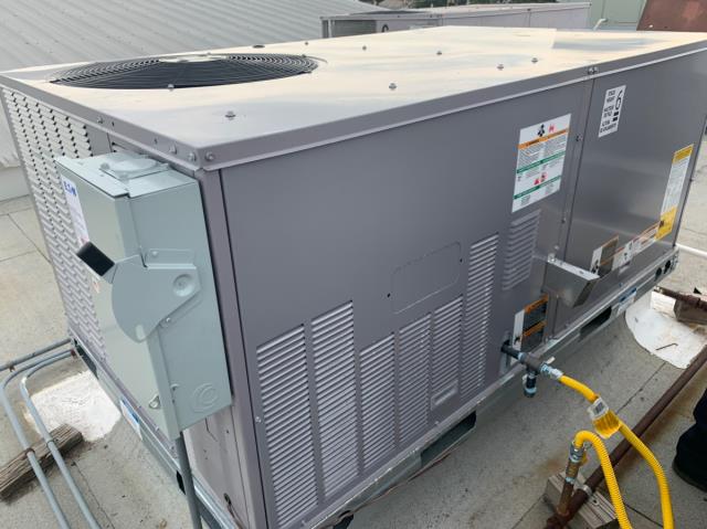 Barbosa Plumbing & AC used a crane to replace the rooftop ac system on a commercial building.