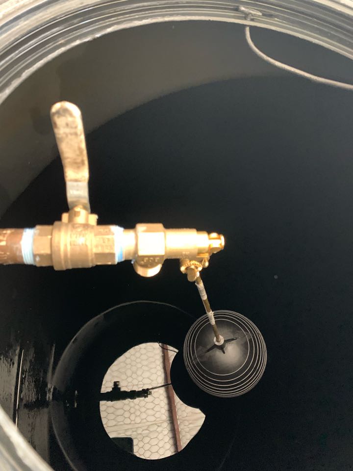 Installed automatic float shut off valve in storage tank
