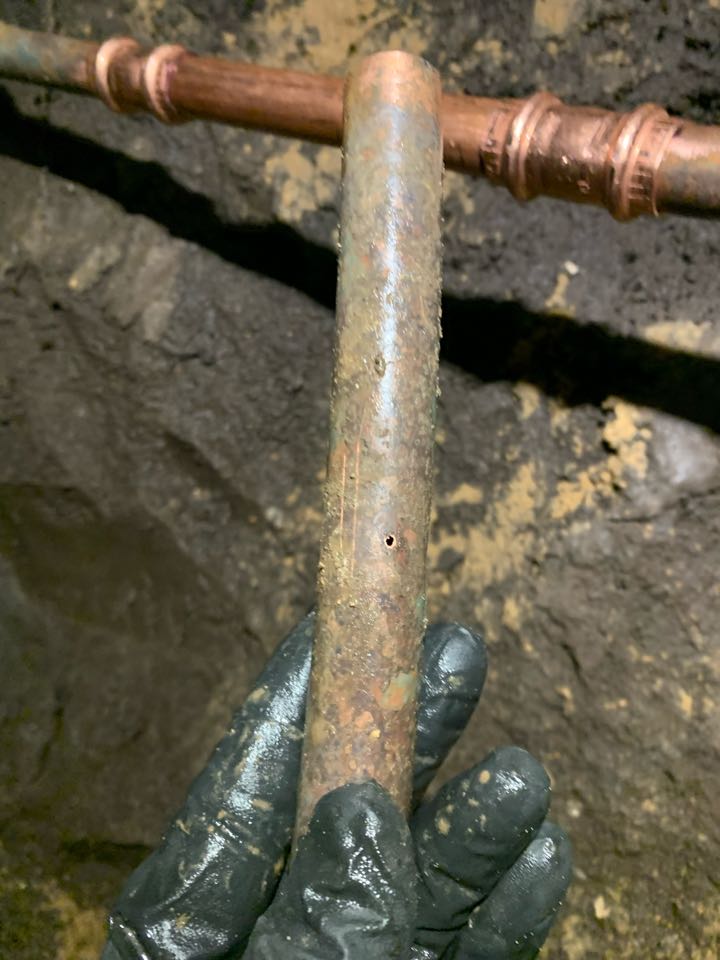 Repaired water leak under house slab on a copper waterline. Installed new copper L pipe and fittings where water leak was removed. Tunnel excavated under home to expose leak.