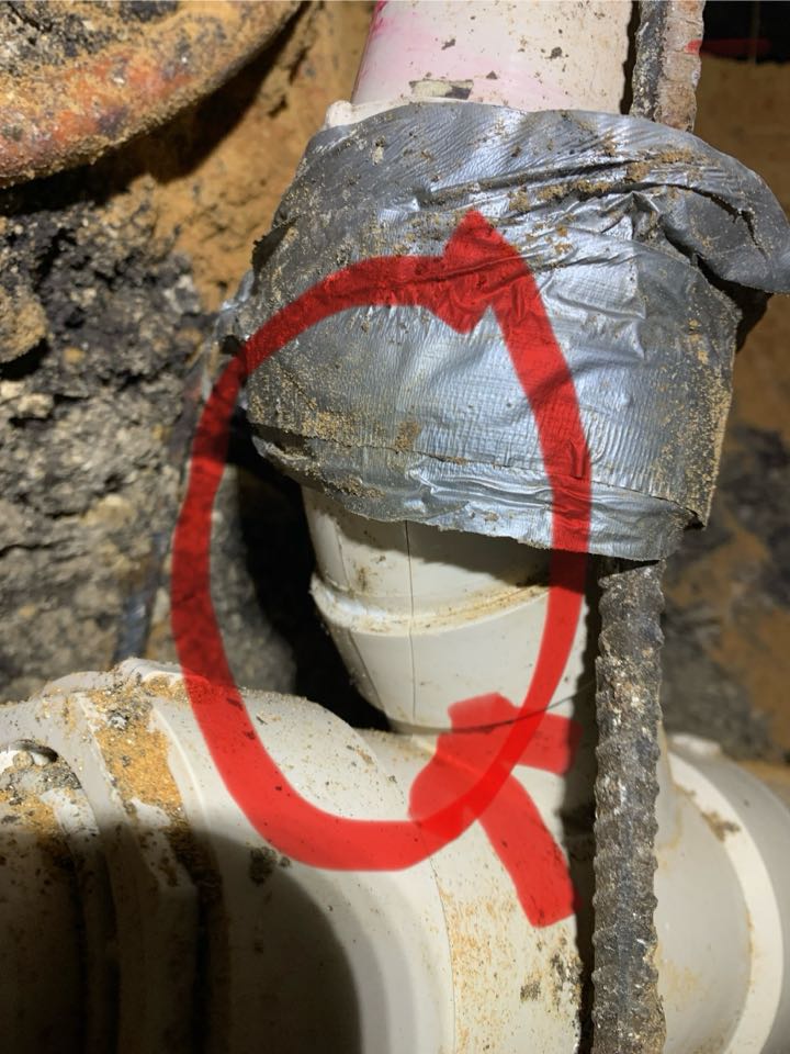 Crack in PVC sewer piping under home.