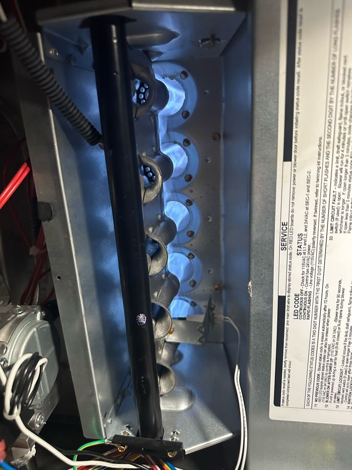 Performing a heating tuneup on two Carrier gas furnaces 