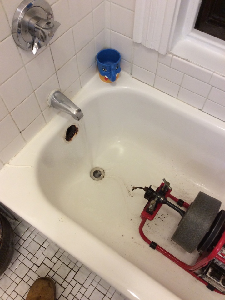 Snaking out a bathtub drain in Boston 