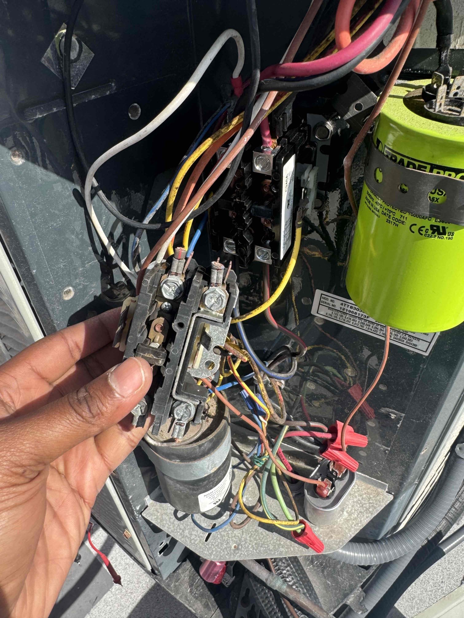 For condenser on roof- contactor is pitted with high resistance. Capacitor is weak. Allowing the system to run with a pitted contactor can damage the compressor with voltage drops. Fan motor has to work harder to start with weak capacitor.

Replaced contactor and capacitor. Tested system function after repair. 