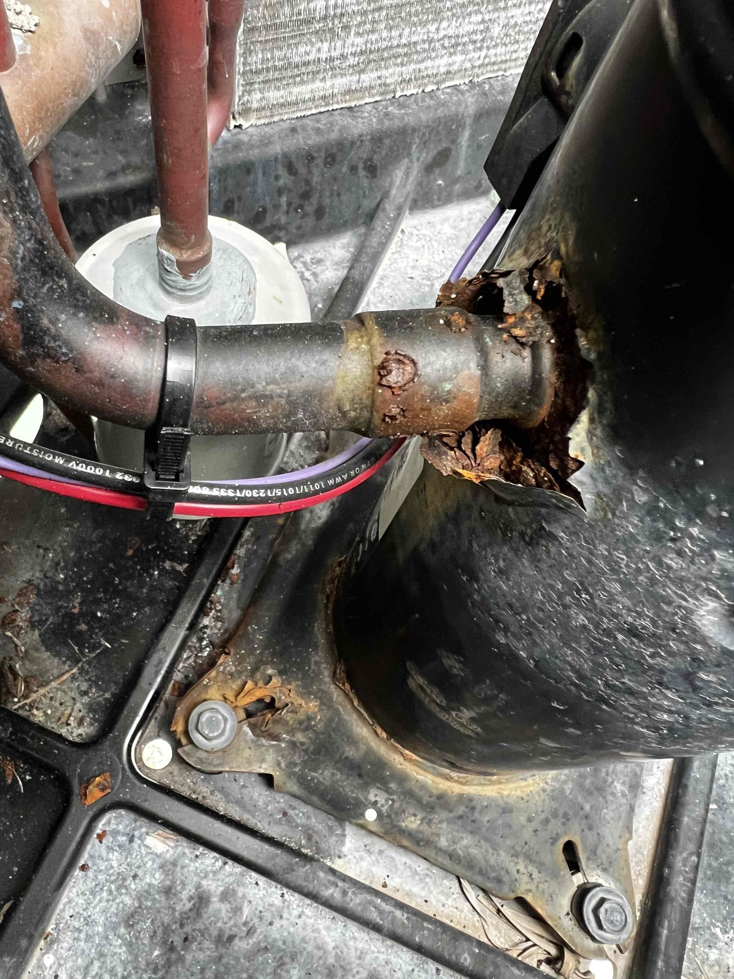 On arrival found unit not cooling due to out of refrigerant. Found condenser extremely corroded. Accumulator rusted out causing all refrigerant to leak. Will submit estimate for repair and replacement options. Made client aware unit is out of warranty and am not able to fully look over system since it is not functioning. After repairs, further issues might present themselves. Unit is not cooling at this time.