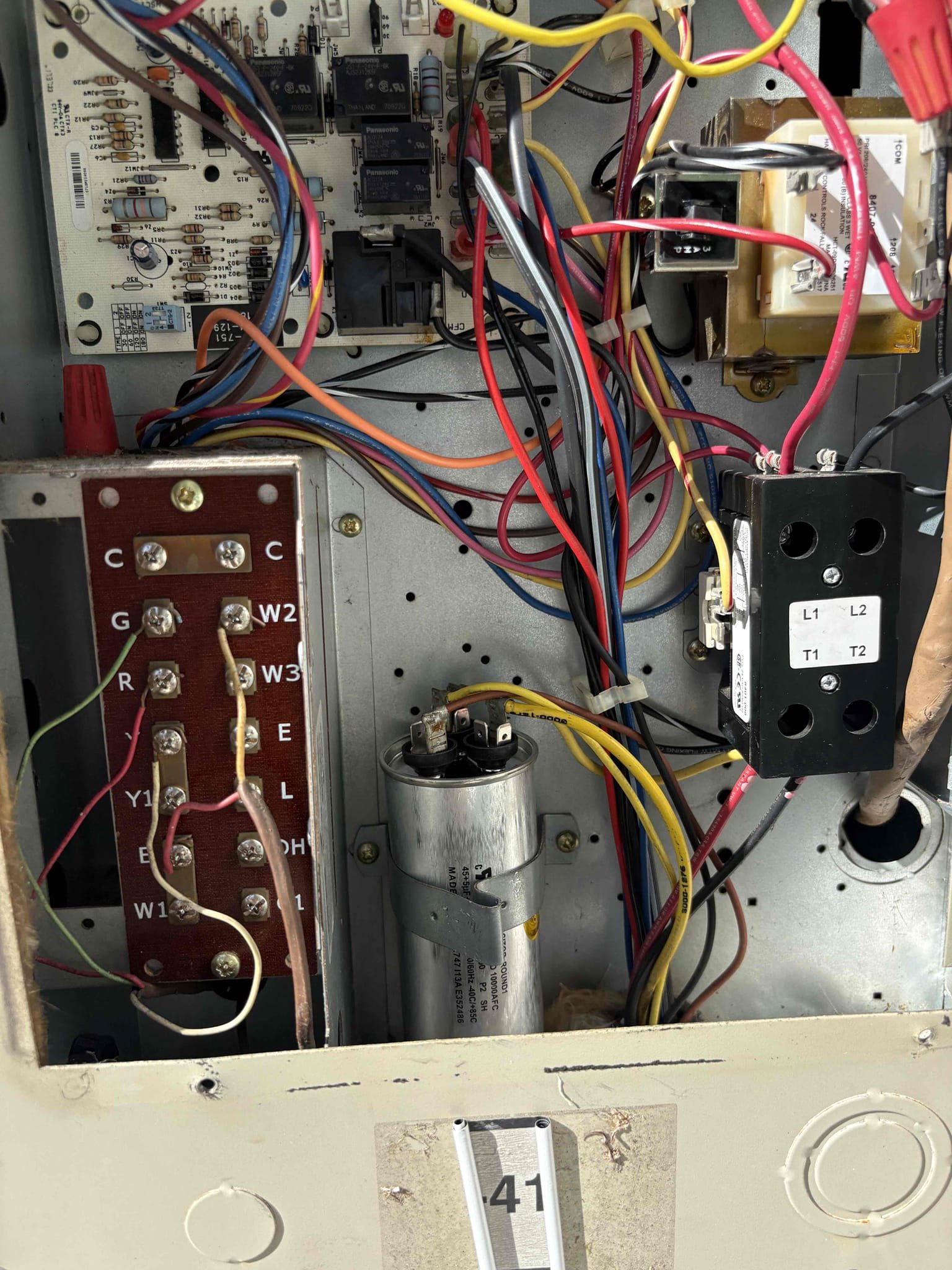 Upon arrival home owner states capacitor was replaced last year. Unit is currently blowing warm air. Found capacitor not secured properly and shorted. Found hard start kit not operating. Replaced capacitor and removed hard start kit. Verified pressures and temp splits. Unit is currently operating. 

5 Year Warranty Capacitor  