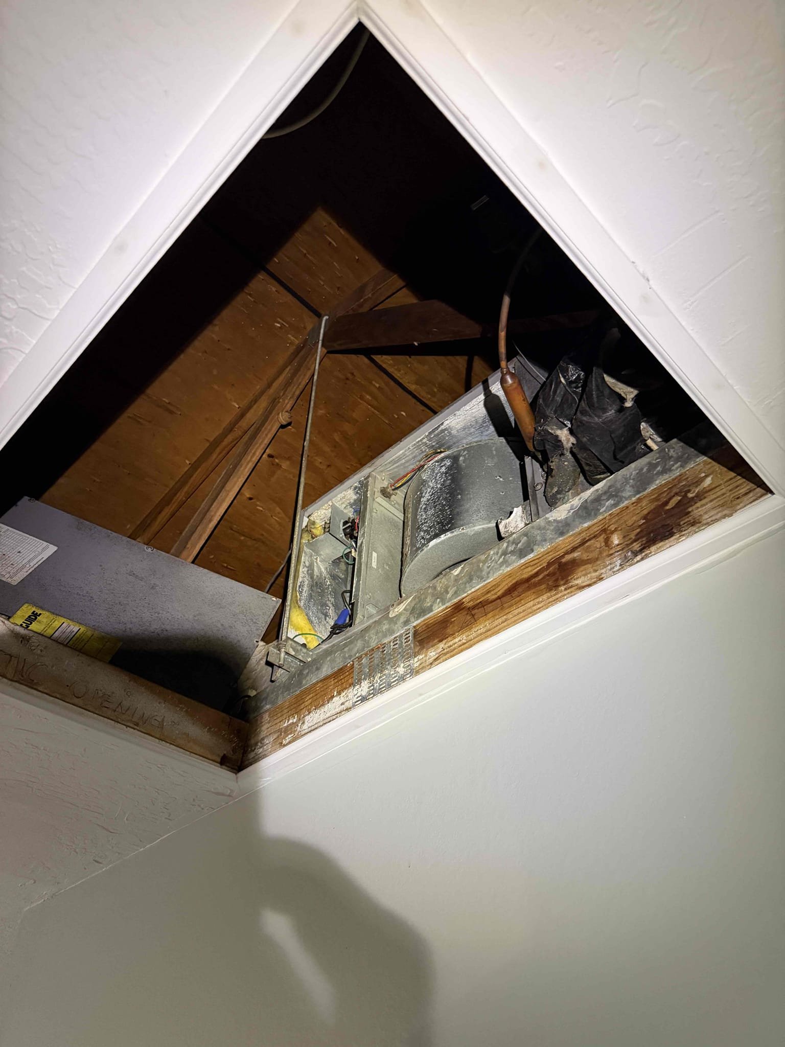 Upon my inspection? Found system thermostat wire to condenser was broke in half. Replaced wire from gutter to condenser. Inspected rest of system. Condenser is in a hard to service spot up against the wall. Checked capacitor. System is cooling at this time. System needs a Maitenence. Client would not like to invest more money into 17 year old system at this time. Indoor blower motor has oil residue. High voltage coming into air handler is questionable. There is only one safety float switch. 