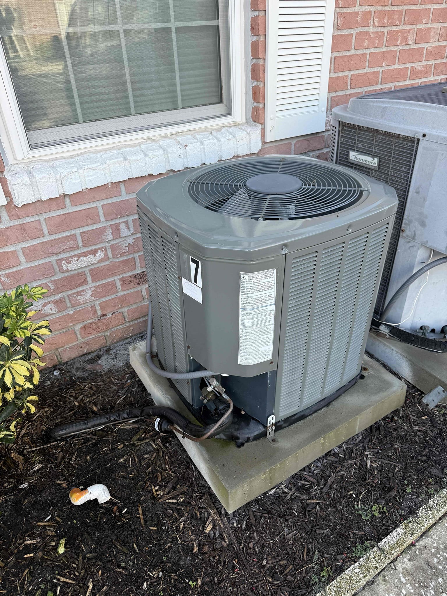 Upon my inspection, found water saturated insulation on bottom of unit. Opened unit and found insulation on back of unit is detached completely and choking off the fan motor. This is causing excess condensation within the unit. Blower will need to be pulled and insulation fastened back to the unit. 
Performed repair and system is cooling properly at this time. Checked condenser for amp draws and capacitor. Cleaned drain line complimentary. Advised client to keep fan on for 3 days and then return to the auto position to help remove water from soaked insulation. 