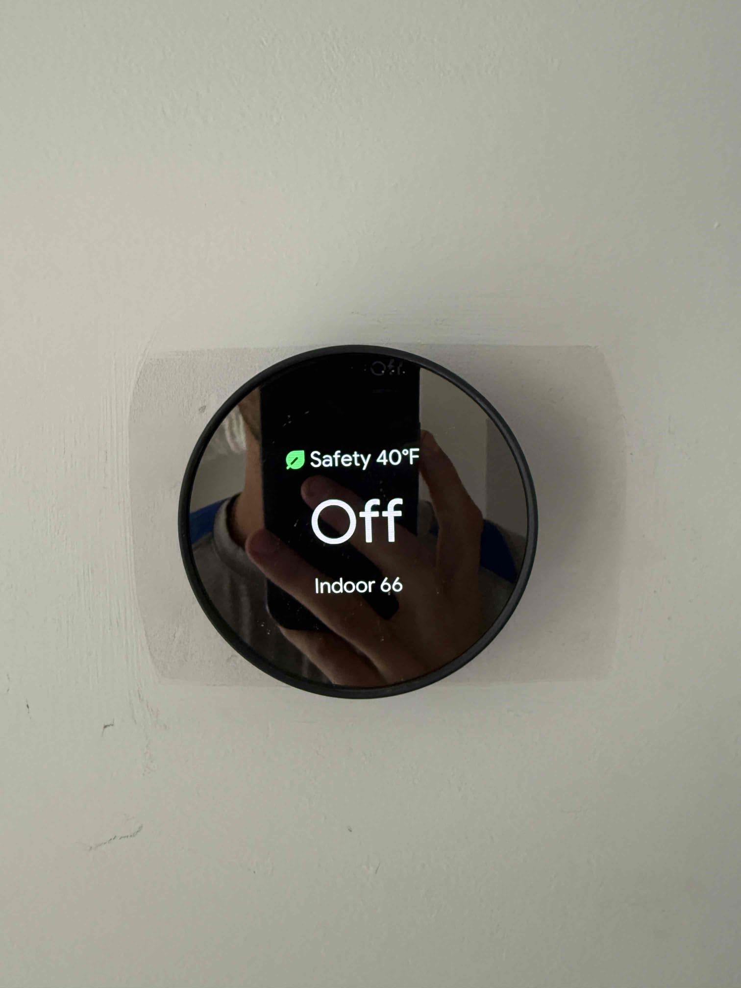 Upon my inspection, found downstairs system was cooling while the thermostat called for heating. System is a straight cool and thermostat was set up for heating pump. Reconfigured settings in google nest app. System is now heating properly. Verified system also cools when thermostat calls for cooling. 