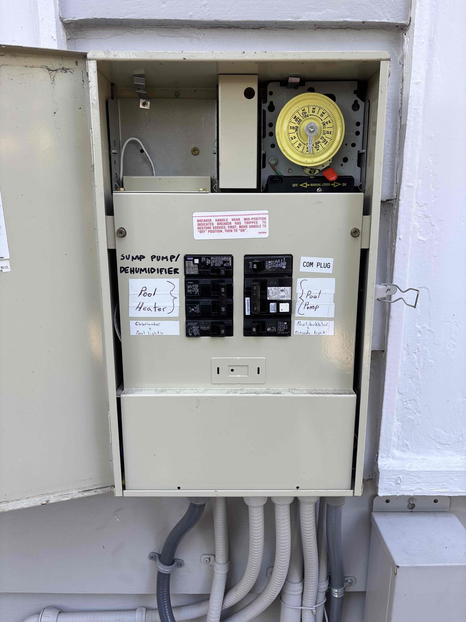 Install a receptacle in the office area under desk for computers and equipment 
Install a dedicated 20 amp breaker in the pool sub panel 
Run conduit on the exterior then into a cut in box in the wall 
*** will need to special order brown receptacle and brown trim plate 