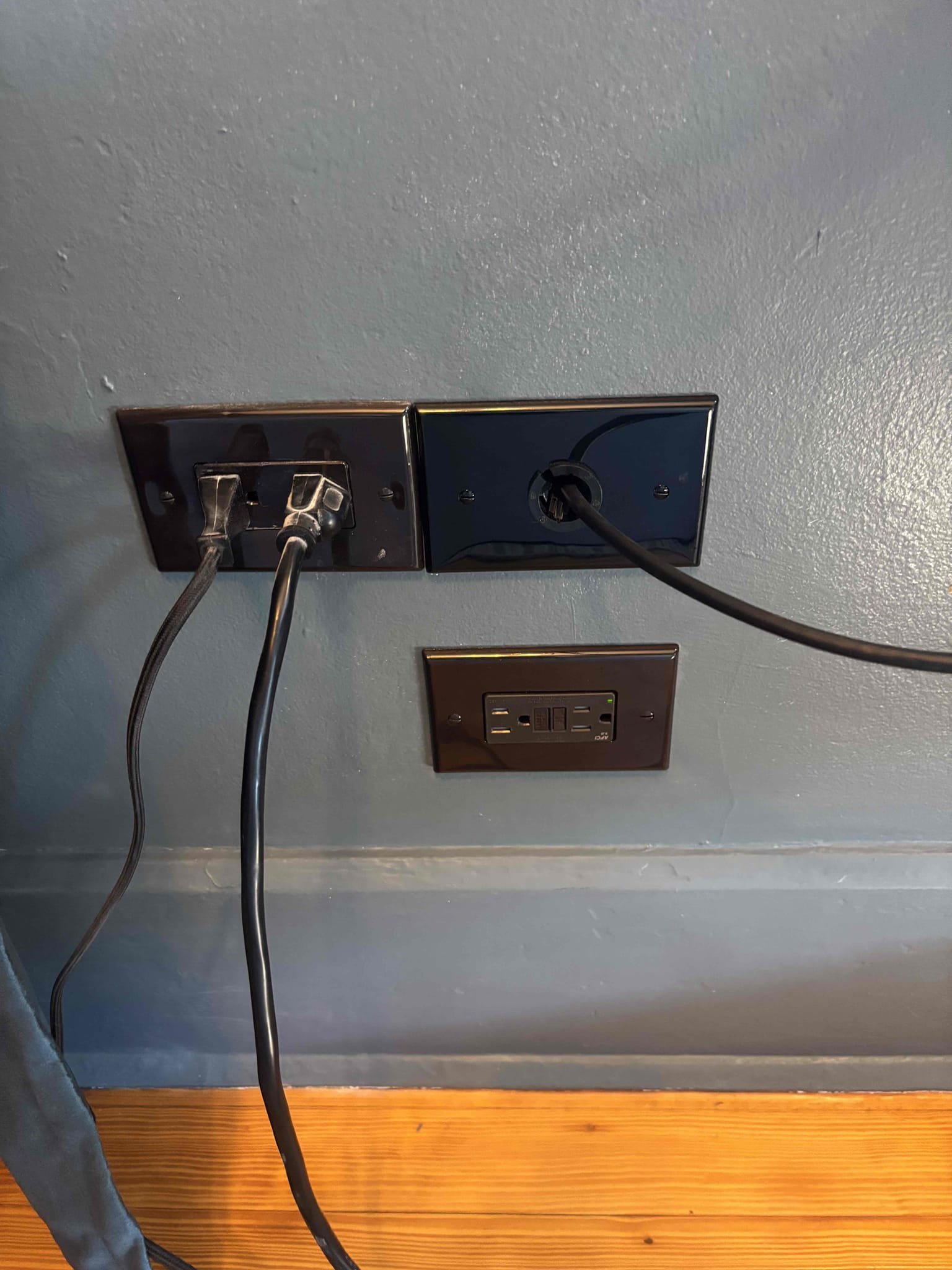 Install a receptacle in the office area under desk for computers and equipment 
Install a dedicated 20 amp breaker in the pool sub panel 
Run conduit on the exterior then into a cut in box in the wall 
*** will need to special order brown receptacle and brown trim plate 