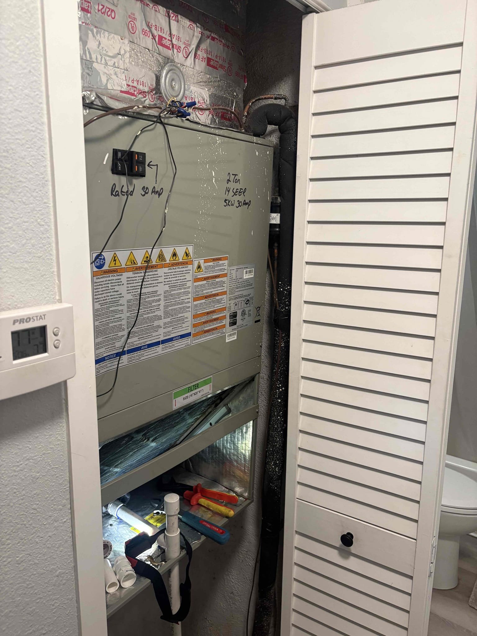 Home owner states unit is leaking water from air handler. Drain line and pan cleared. Found safety switch male fitting improper size and loosely sliding out of unit. This causing water to bypass. Safety switch was glued. Had to replace safety with new male fitting. Also the did drain line and fittings. Verified system operations and no further leaking. 

Next step would be replacing drain pan if issue persist 
