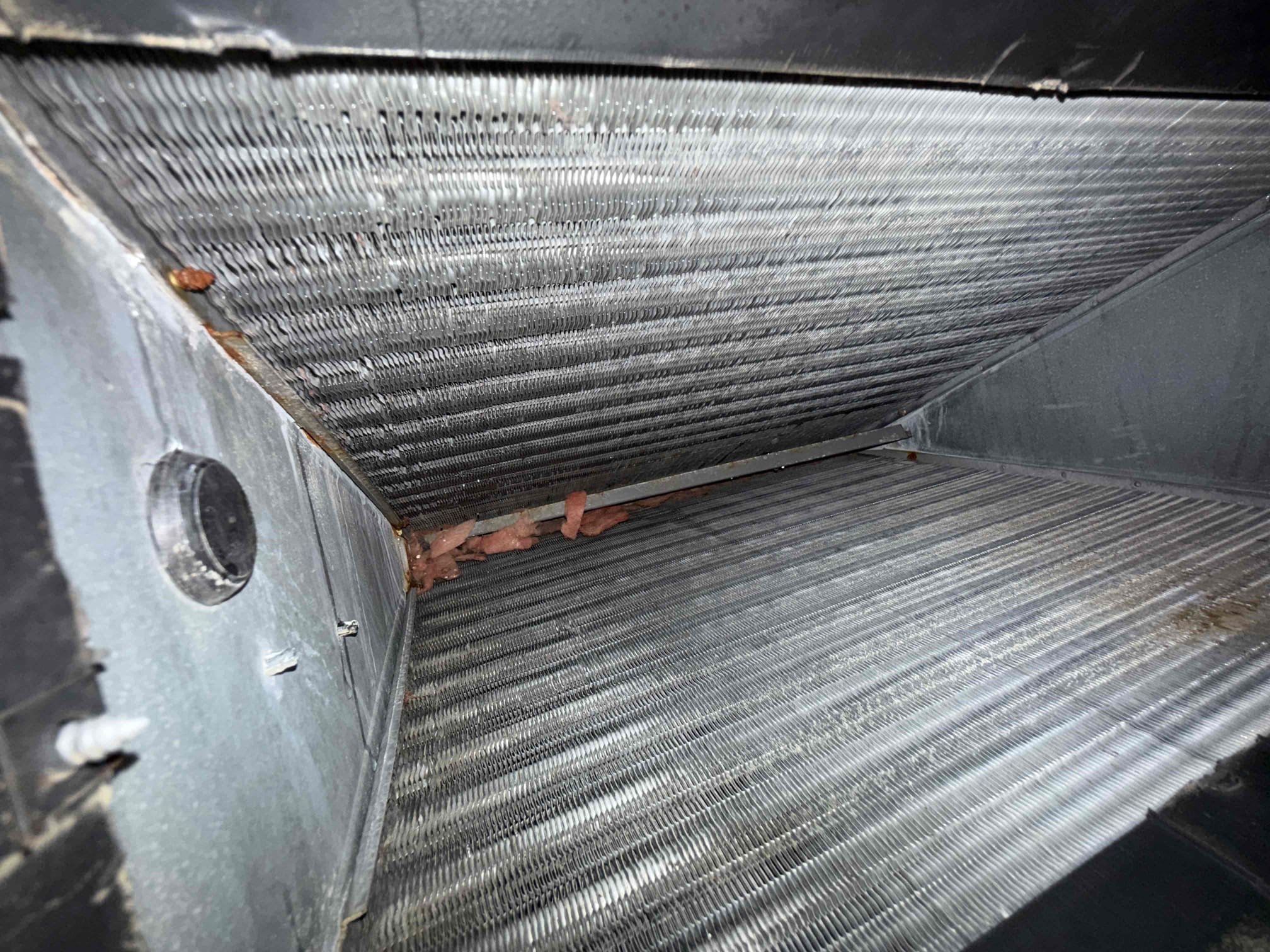 Performed Maitenence on system. Cleaned/treated drain line and primary drain pan. Inspected condenser coils. Evaporator coils are clean. Verified safety float switch functionality. Checked amp draw on compressor. Checked amp draw on fan motor. Fan motor is pulling .94 amps with a max rating of .6. Fan motor is over amping and at risk of failure. Checked capacitor is not within factory range (reading 40 out of 45 with a tolerance of 5%. Replaced capacitor. After replacing capacitor, fan motor amp draw is at .82.  Inspected Contactar. Made sure all connections are tight. System is cooling with a 20° temperature split at this time.
Client had concerns of humidity. Found multiple holes and leaks in old duct work. Recommending duct work replacement and sent quote to client. Included air purification systems with duct work quote per clients request. 