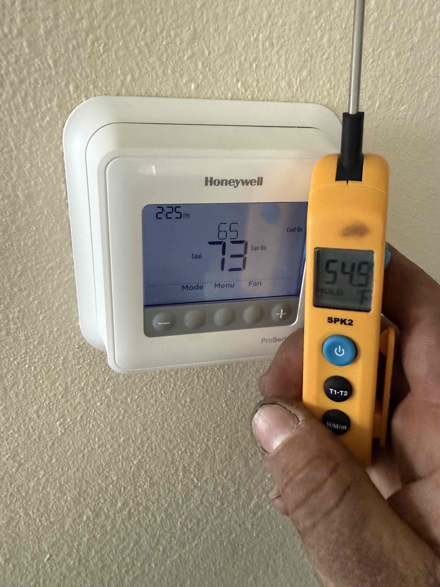 On arrival found unit not cooling due to broken thermostat wire on roof for condenser. Wire was pulled from service panel possibly from roofer tripping over wire. Replaced section of bad thermostat wire. Start and test. Pressures good. Temp split good. Compressor noisy on start up. Made client aware possible compressor failure in near future. Unit cooling at this time. 