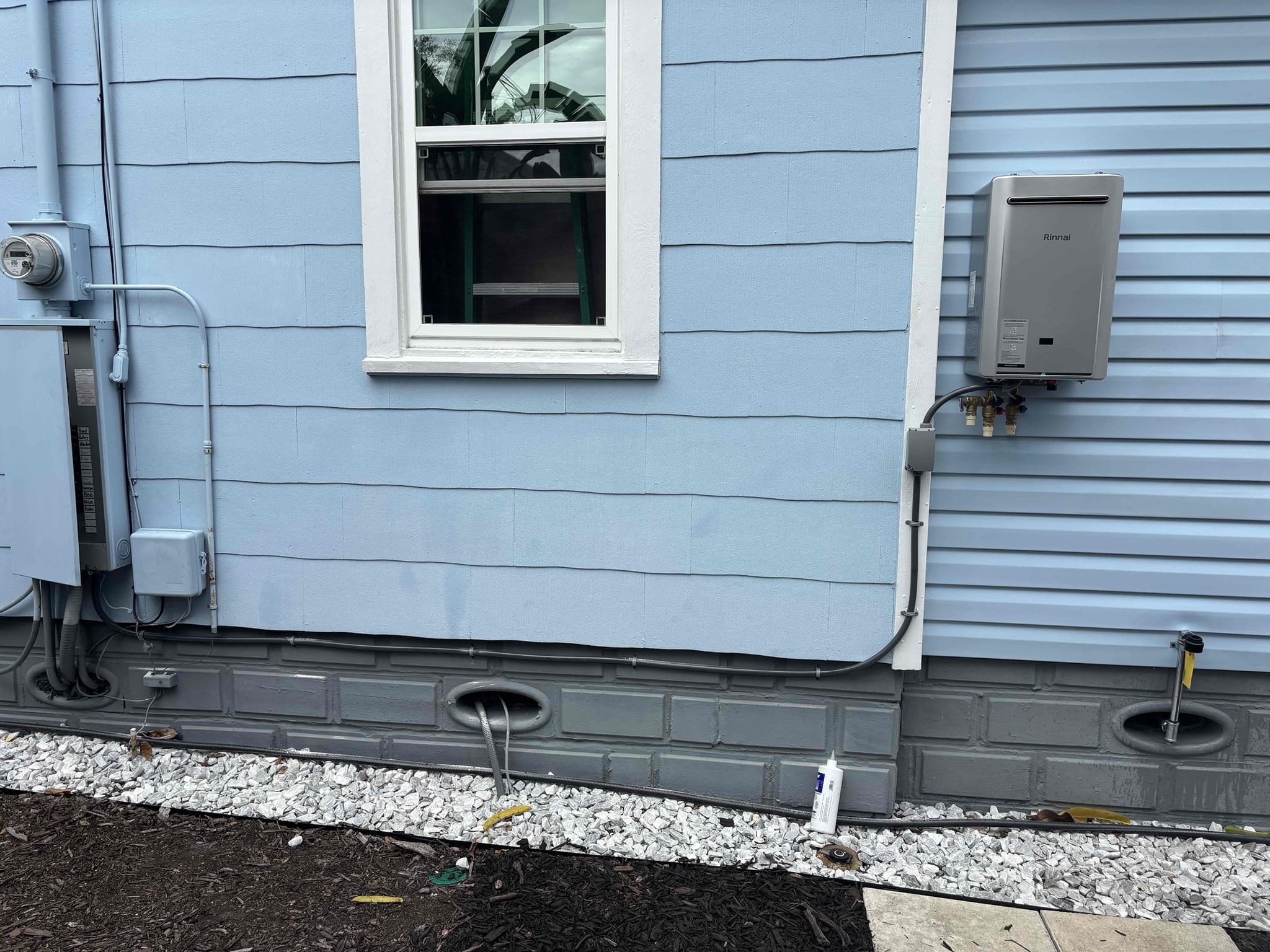 Install electrical to to gas tankless water heater 
Install disconnect switch 
Install GFCI breaker 