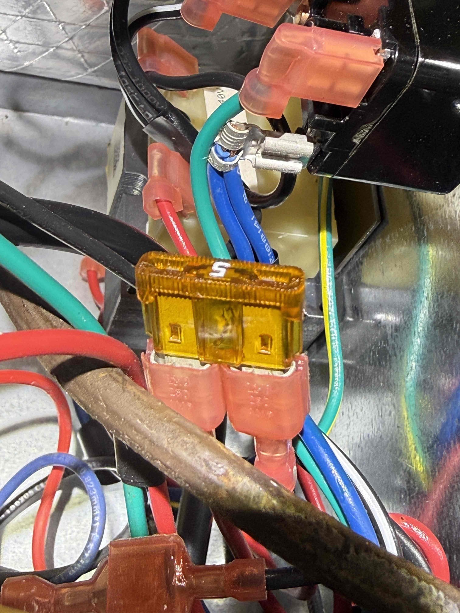 Upon my inspection, found blown 5amp fuse in air handler. Performed a low vintage short diagnosis. Found that the existing broken UV lamp was causing the fuse to blow. Replaced Uv system and turned system back on. Thermostat took a really long time to boot back up and call for cooling (about 30 mins). When system stayed up, verified operations and found weak capacitor. Replaced capacitor. Performed Maitenence on system. System is cooling at this time with a 20° temperature split. 