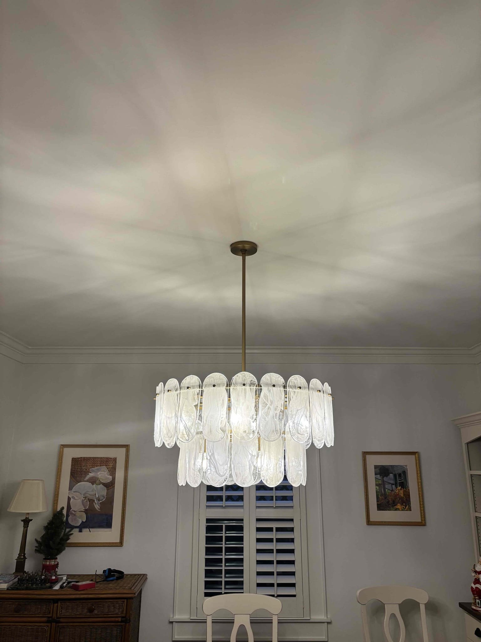 Install 3 customer provided chandeliers 
Install and program thermostat
Replaced bad dimmer switch with a standard light switch 
Wall sconce did not have a box behind it in bedroom 
Mounted a box and tied electrical back 
The wall sconce location over the bed did not have a box and customer was good with removing it and not adding a light there 
Replaced chandelier with customer supplied one  
Installed new toggle switch dimmer for chandelier and removed the switch that was not hooked up to power 