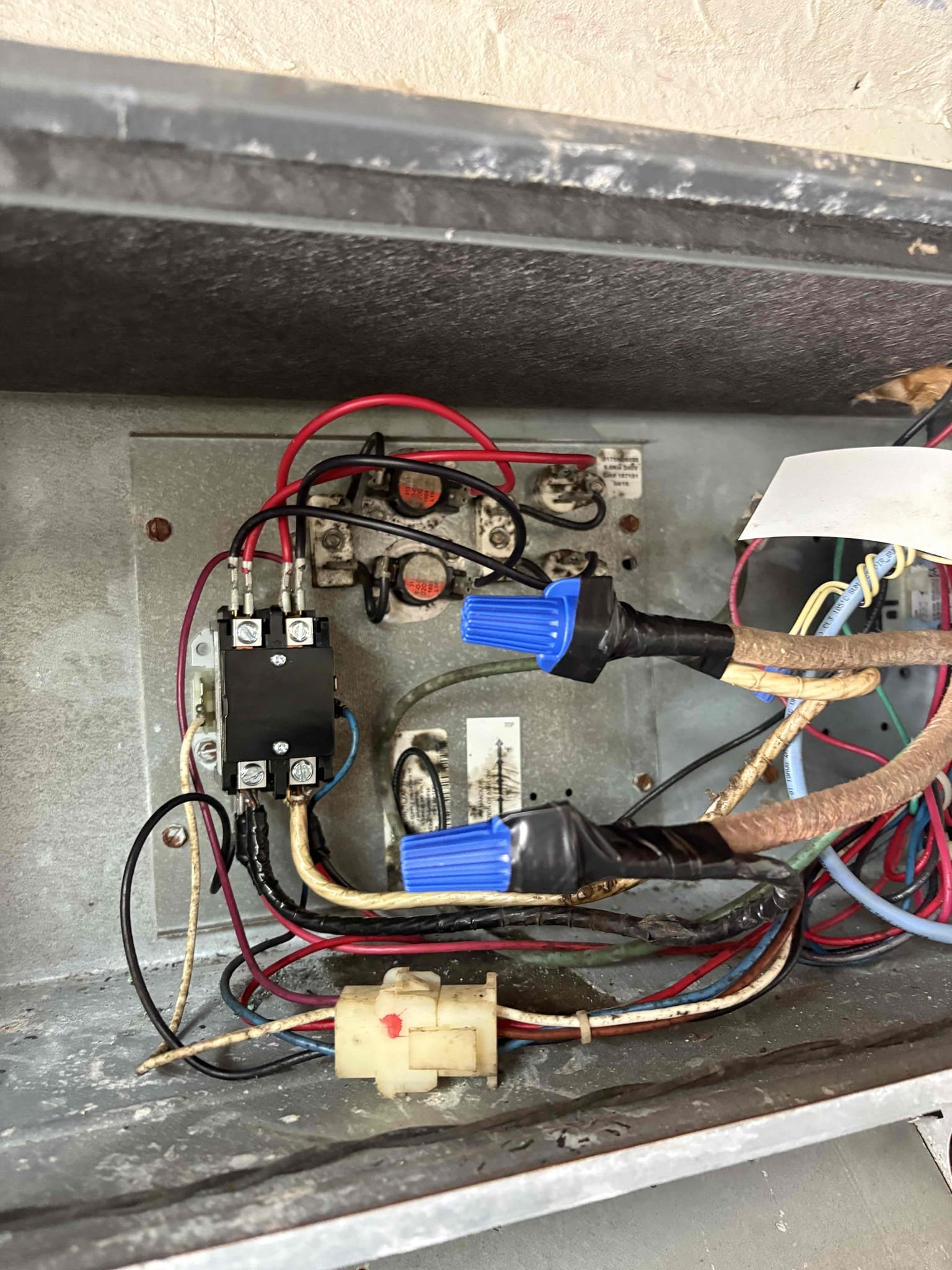 Upon arrival home owner states unit isn’t cooling or heating. Found high voltage connections to heater kit contactor burnt. Connections shorted out and burnt up contactor. Cloth wiring coming for air handler disconnect to air handler. Replaced contactor, re did connections (low/high voltage), and replaced 3 amp fuse. Tested cooling and heating. After letting heat run for 5-10 minutes breaker tripped. Unit is only pulling 40 amps and breaker rated for 60. Would recommend replacing breaker and whip together 

Bacterial growth starting to accumulate inside air handler 

Recommend replacing cloth wiring high voltage whip (air handler)

Air handler coils impacted with debris/growth (recommend cleaning)

Home owner putting new filter in today 