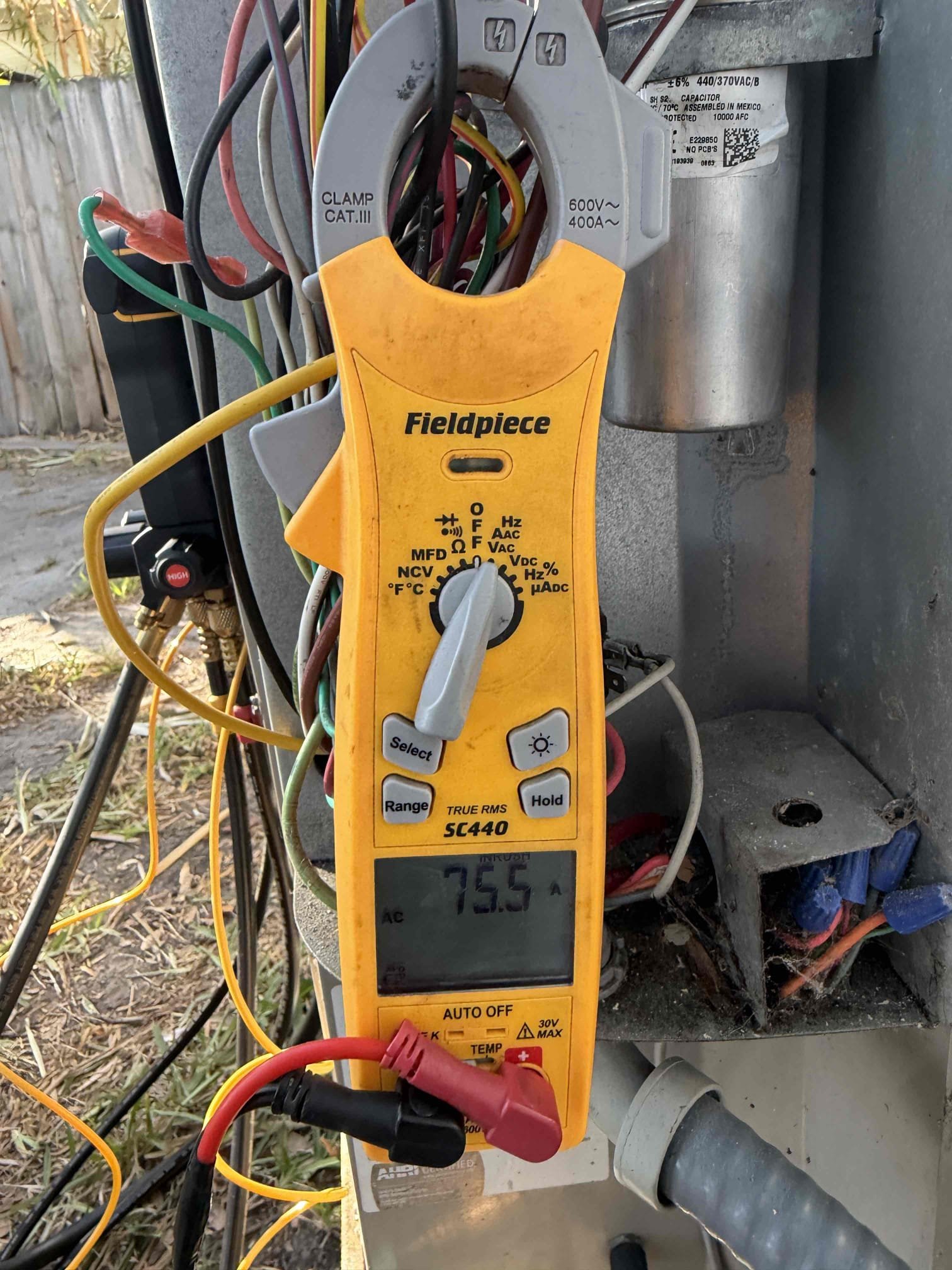 Upon arrival, found system showing signs of low refrigerant. Pressures were low. Performed leak search and found no leaks at this time. Included 1lb of refrigerant complimentary. Pressures are good at this time. Found improper size capacitor and bad fan capacitor. Replaced capacitor with proper size and proper charge. 

Unit was flooded. At risk of future issues. 