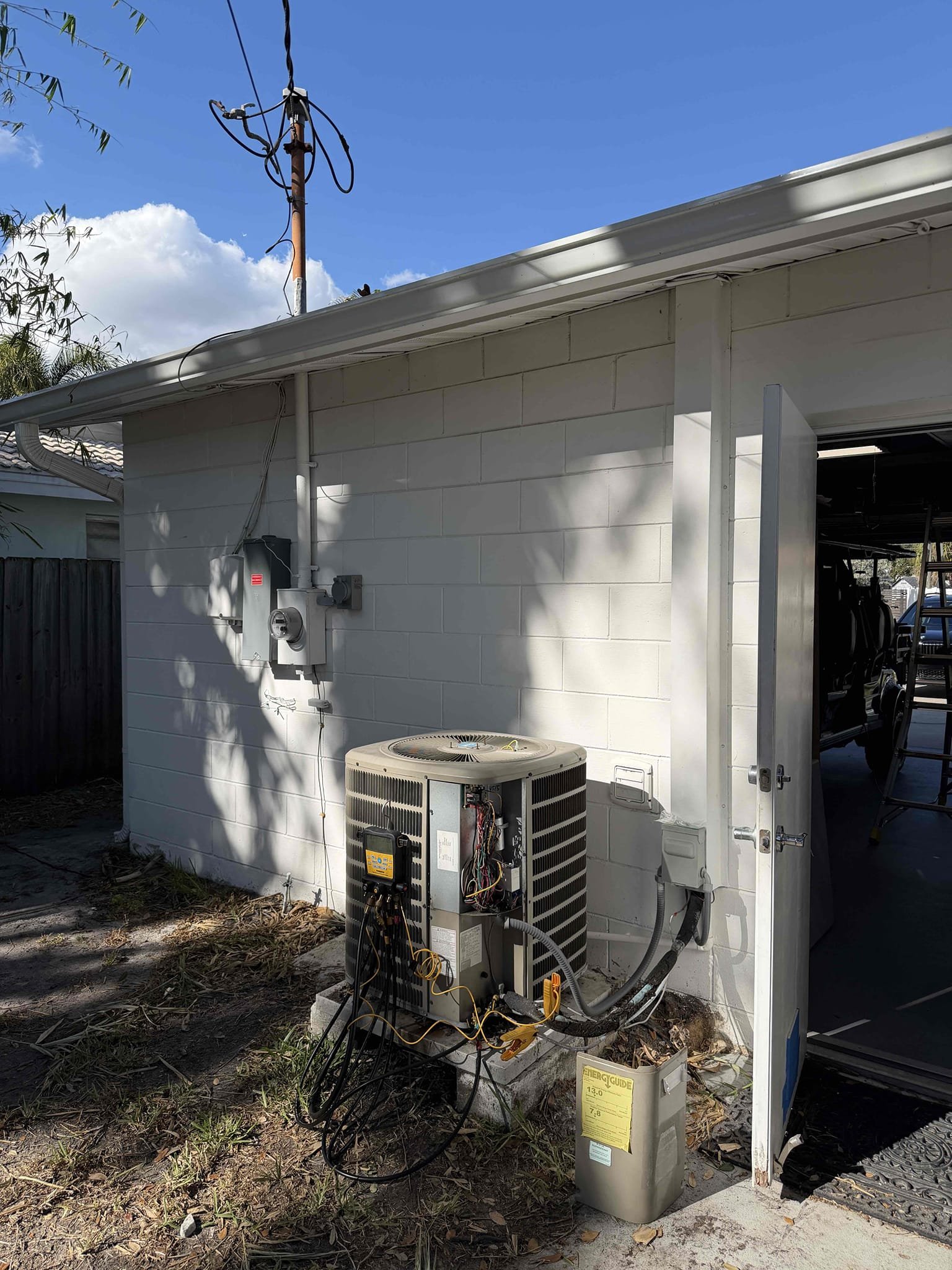 Upon arrival, found system showing signs of low refrigerant. Pressures were low. Performed leak search and found no leaks at this time. Included 1lb of refrigerant complimentary. Pressures are good at this time. Found improper size capacitor and bad fan capacitor. Replaced capacitor with proper size and proper charge. 

Unit was flooded. At risk of future issues. 