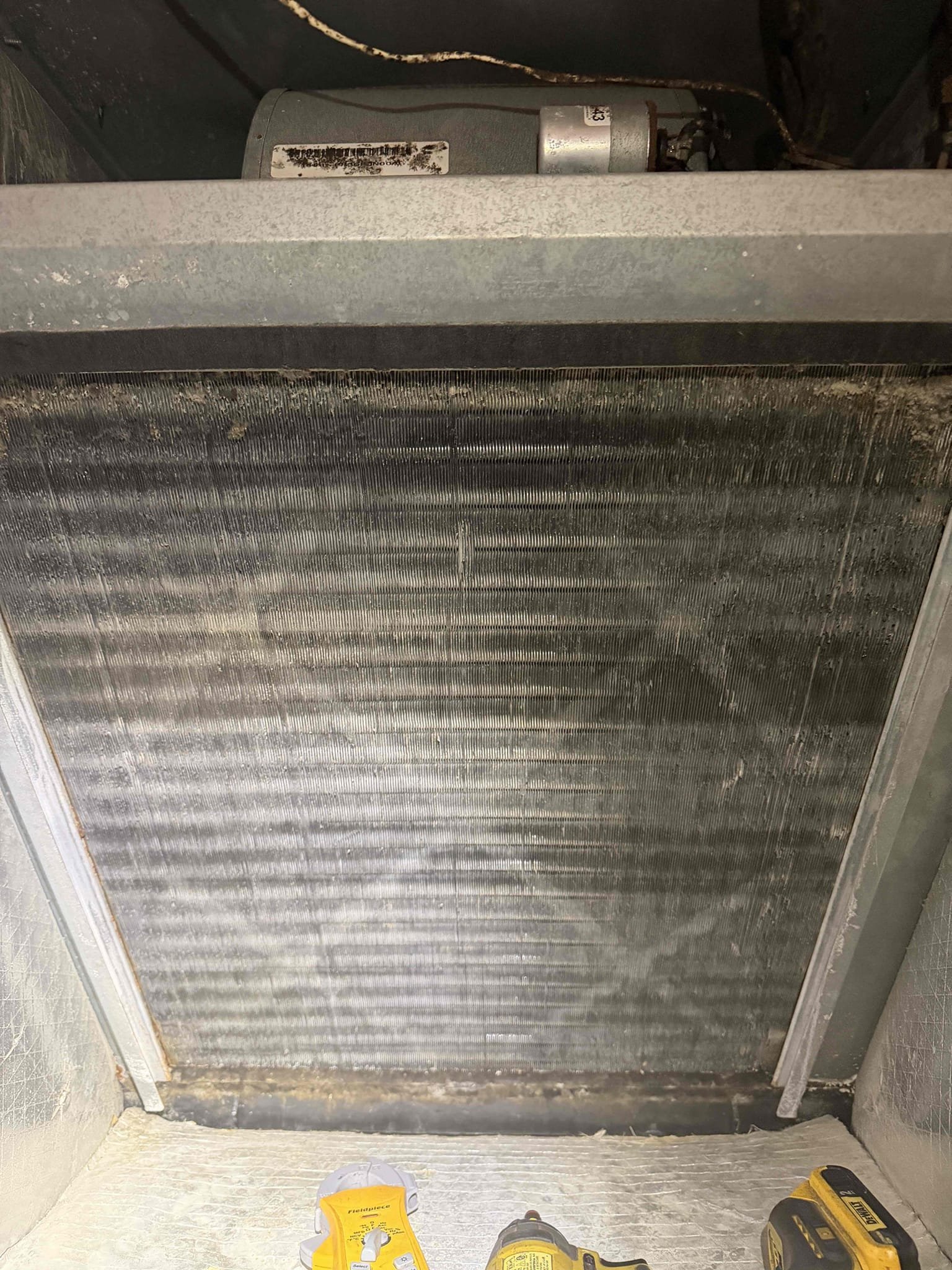 Upon arrival, found AHU breaker tripped. Reset breaker, inspected wiring. Found insulation on back of AHU is peeling off. Unit has restricted air flow from dirty evaporator coils. Fan motor is at risk of failure. In heating mode this could be causing the amps to spike higher than normal and tripping the breaker. Recommending coil cleaning, fastening the insulation back to the unit. Also recommend replacing the breaker if the issue persists due to a weak breaker. 
Quotes sent for repairs and system replacement due to age of system. 
System is at risk of more failures due to age and there is no guarantee with these repairs. 
Verified heating and cooling work at this time. 