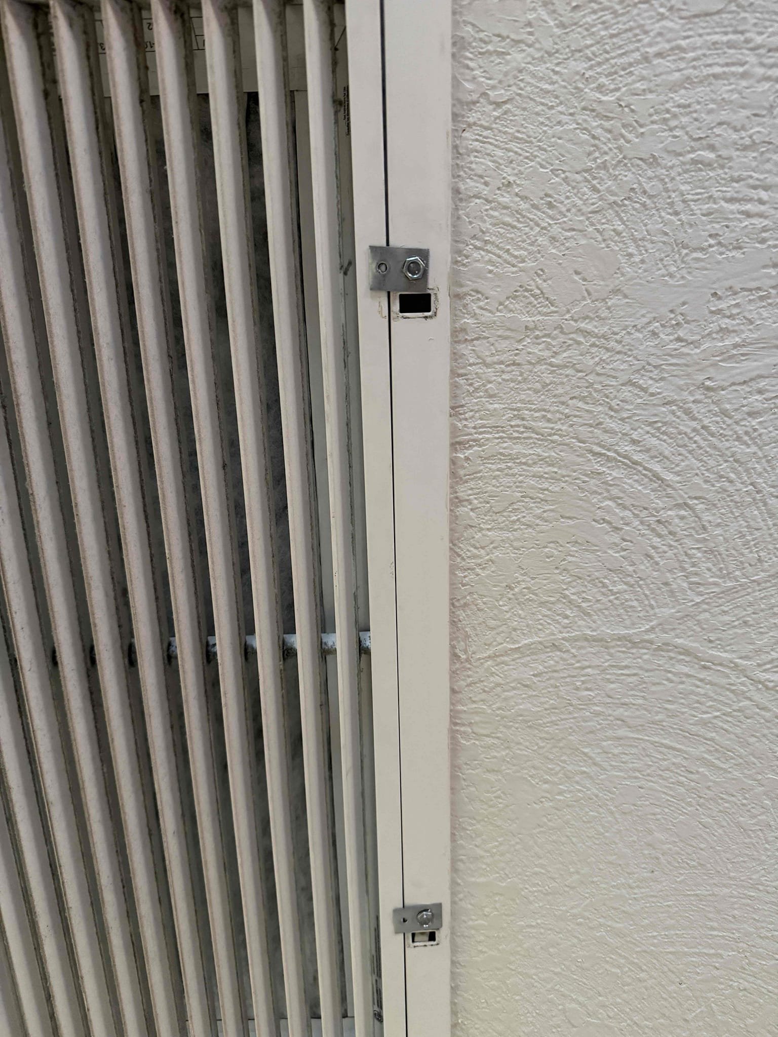 Found the tabs broken off on filter back return grill. Temporarily fixed it with screws and short metal tabs to keep filtered door up. Client may be interested in having a new filter back return grill installed.