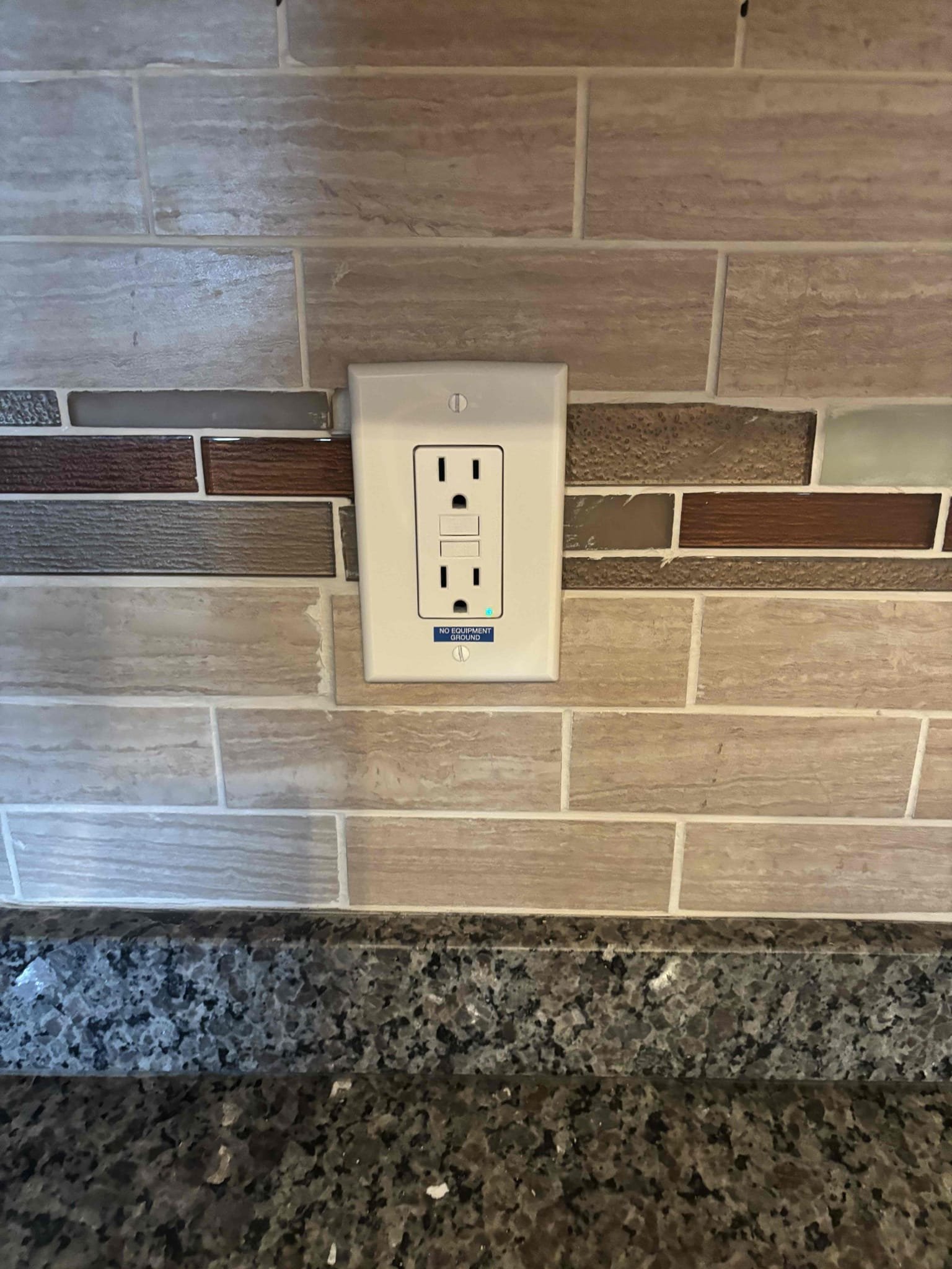 Install ground bar in panel to separate grounds from the neutral bar 
The outlets in the kitchen do not have equipment grounds 
Installed no equipment grounds stickers on GFCI receptacle 