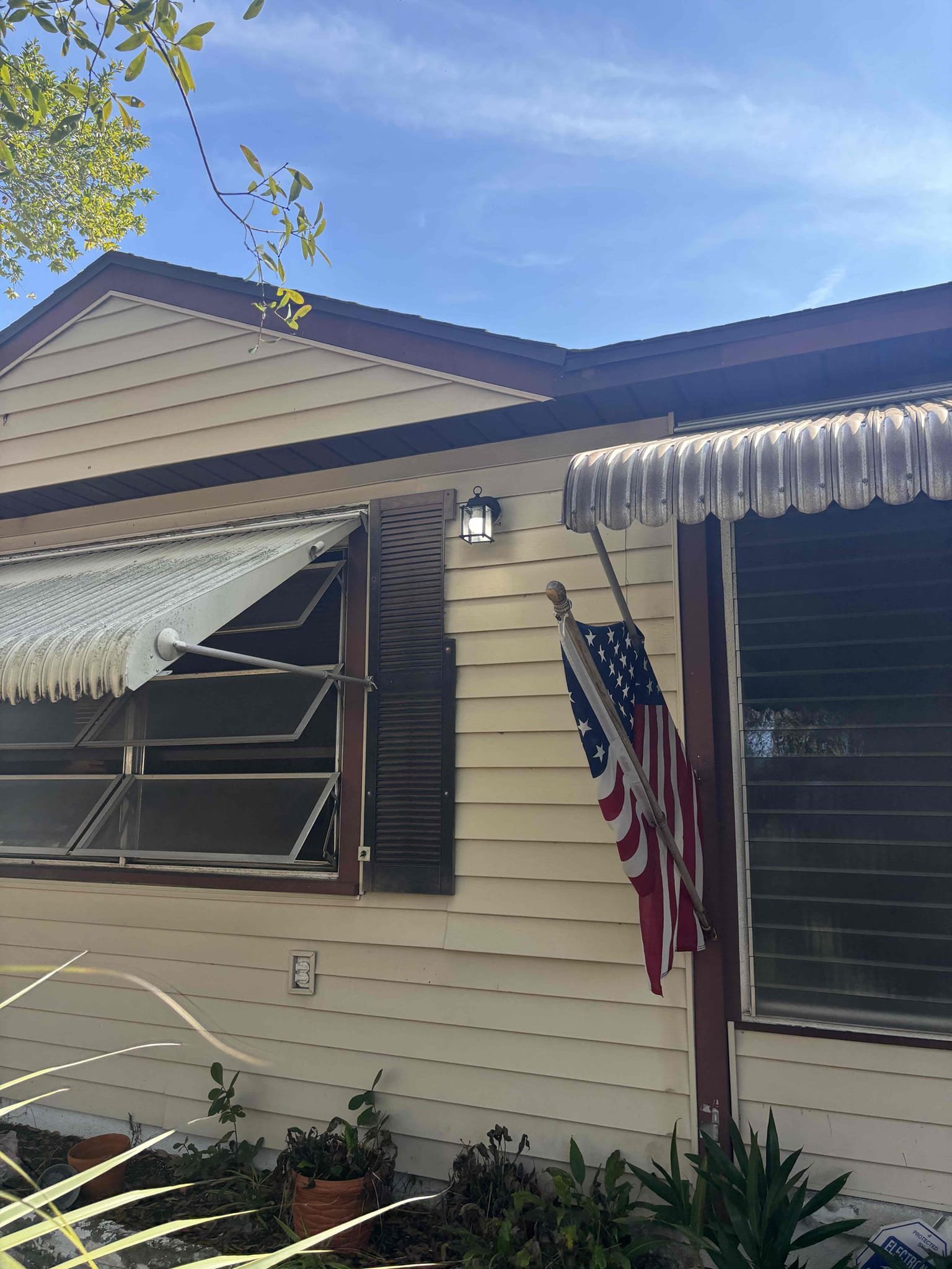 Run new dedicated circuit to kitchen counter for small appliances from panel 
add a breaker in the panel 
Add a GFCI receptacle 
Install customer provided exterior light 