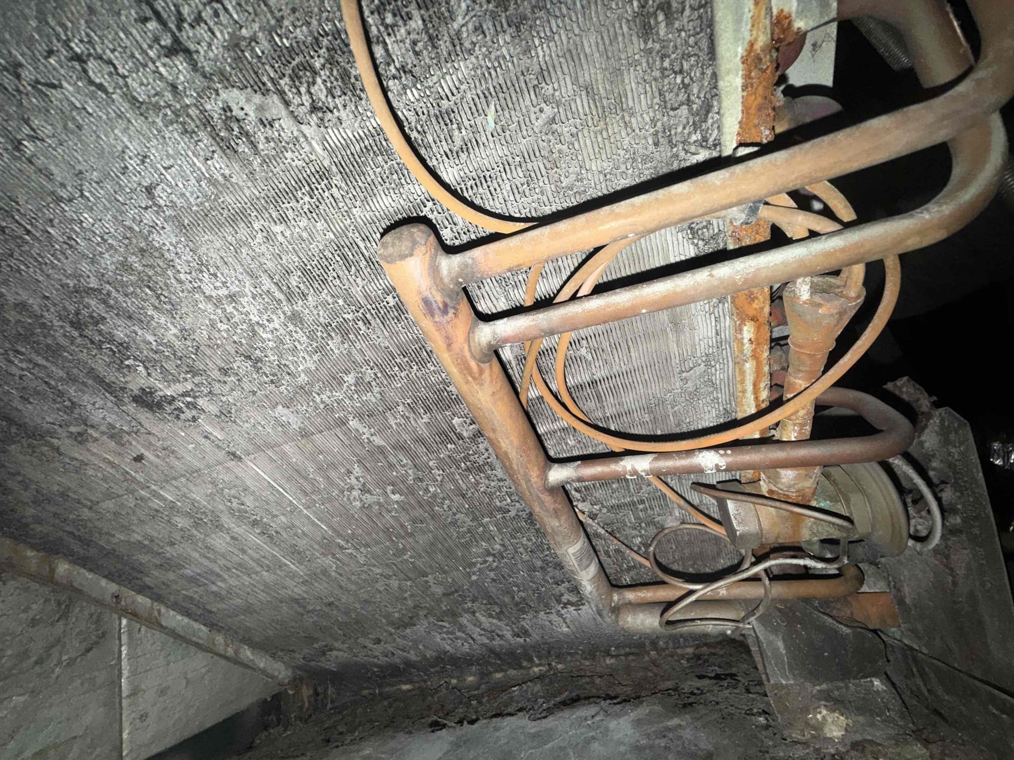 On arrival client states that unit isn’t heating or cooling properly. Found system completely empty on refrigerant. Unit is 18 years old in poor condition. Recommend to replace system. Found evap coil and blower full of debris and corrosion. Some ducts were repaired and replaced. Recommend to replace 2 ducts that are torn and repairs that were made to them are poor. Will submit estimate for system replacement.