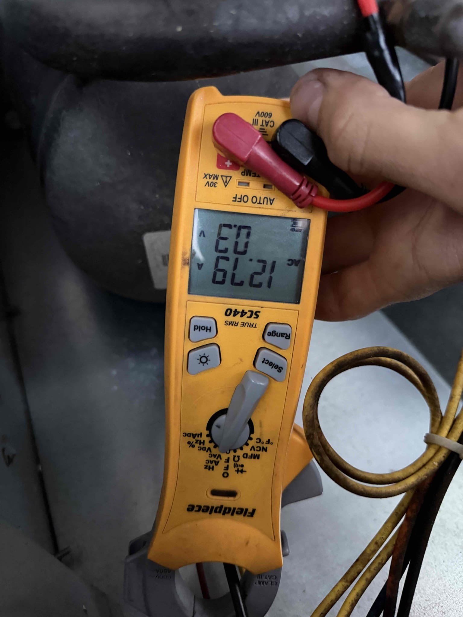Upon my inspection, found thermostat not receiving 24 V. Checked package unit for proper high voltage and 24 V from the transformer. Found that the old humidistat underneath the thermostat was set to the off position which was not allowing 24 V to pass to the thermostat. Turn the humid thermostat on and system started up. Check the capacitor and amp draw readings at the unit. System is cooling at this time. 
Found heavily dirty/impacted air filter. Clean filter for Client but recommended buying disposable filters. It sounds as if the blower motor is having a hard time sucking air through the air filter.