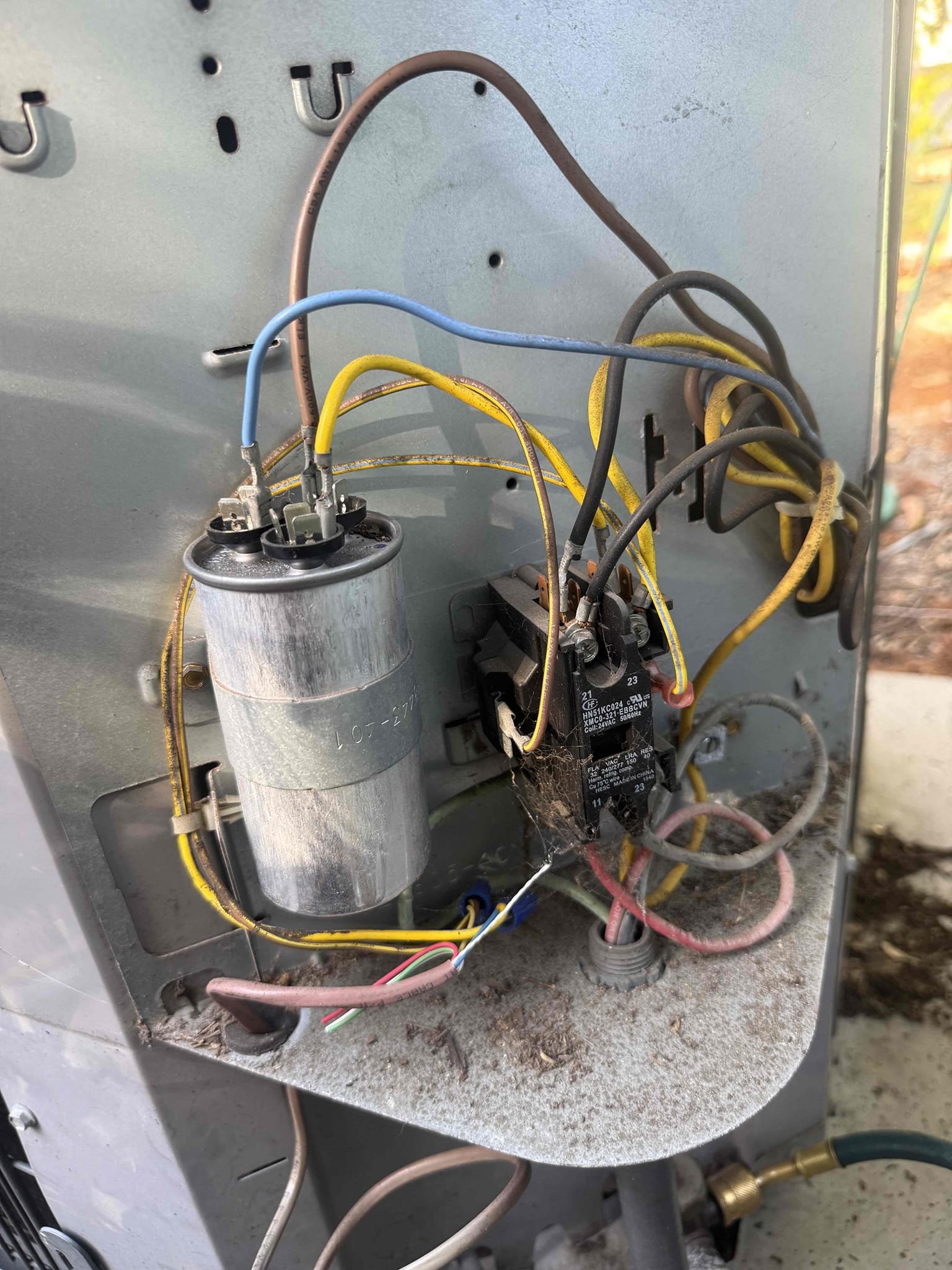 On arrival found unit not cooling due to blower not engaging. Found thermostat not configured properly to turn blower on. Programmed thermostat and connected C wire for proper power to nest. Found pressures and temp split below factory specs. Inspected condenser and found weak capacitor and worn contactor. Made recommendations to client and they declined at this time. Unit is cooling with a 16* split. Client will call in 3 months to perform maintenance.