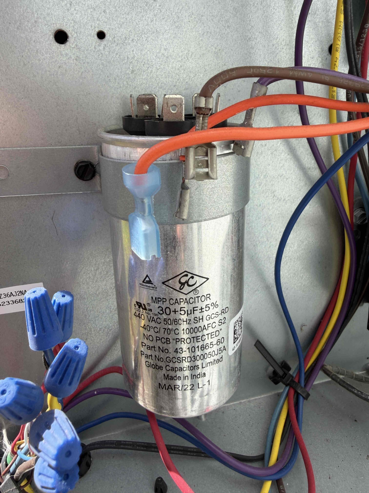 Performed Maitenence on system. Cleaned/treated drain line and primary drain pan. Cleaned condenser coils. Evaporator coils are clean. Verified safety float switch functionality. Checked amp draw on compressor. Checked amp draw on fan motor. Checked capacitor is not within factory range. Replaced capacitor under parts warranty. Inspected Contactar. Made sure all connections are tight. System is cooling with an 18° temperature split at this time.