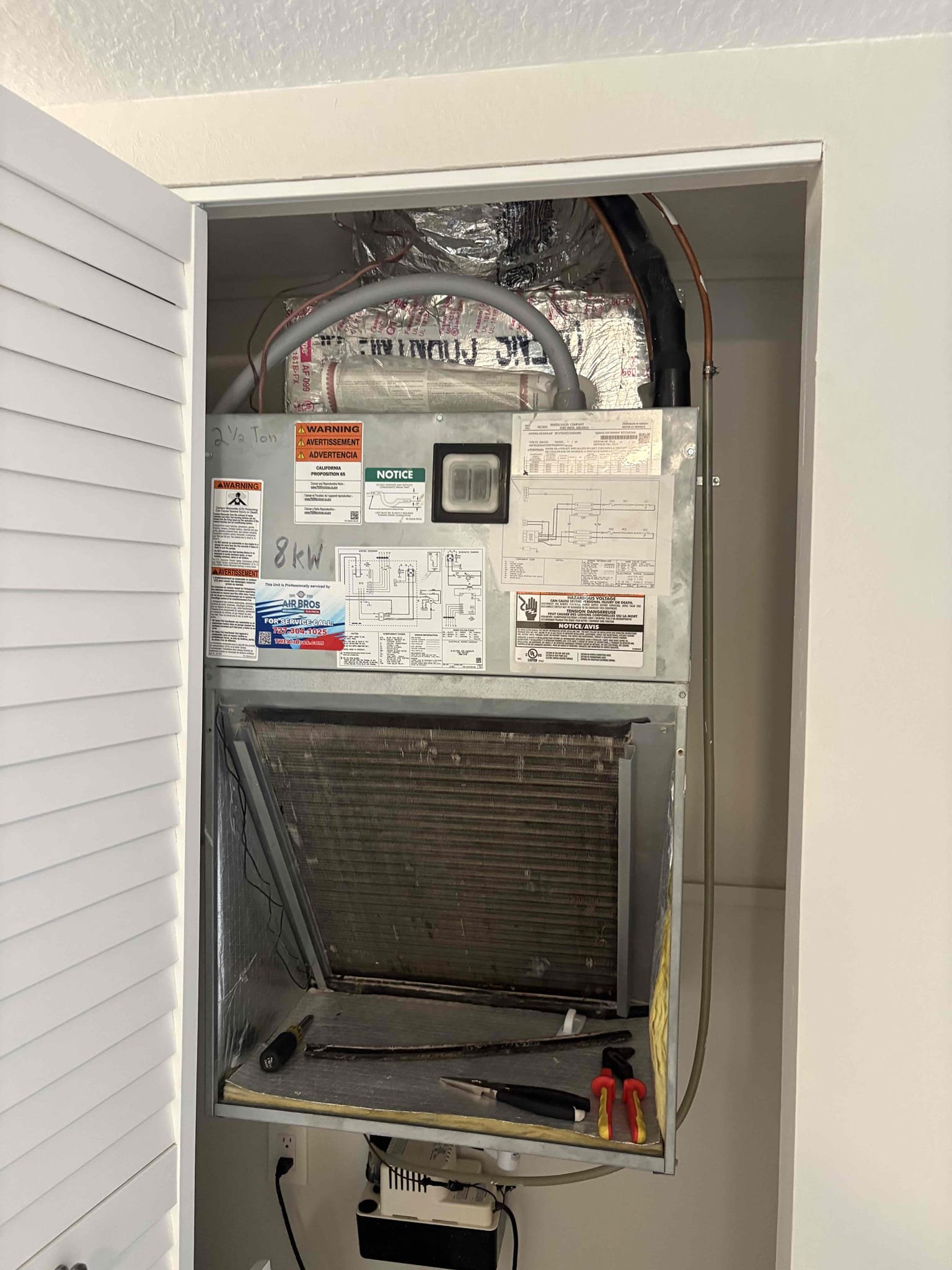 Drain line clogged causing primary safety switch to trip. Condensate pump tilted forward not allowing pump to engage. Cleared drain line and drain pan. Cleared condensate pump. Added drain treatment and flushed pump line.  Verified system operations 