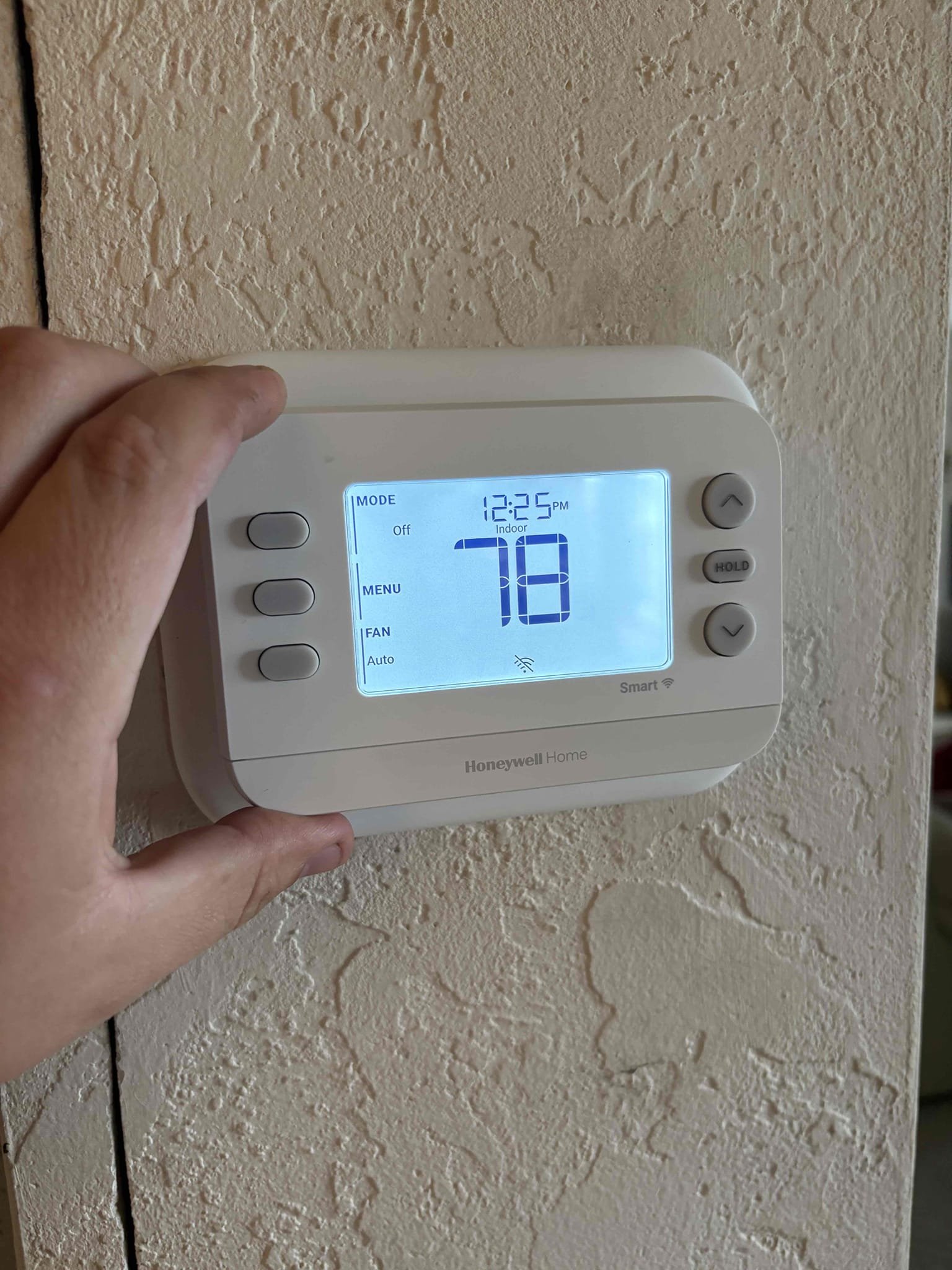 Upon arrival home owner states unit has flashing code. Code was for normal operations. When testing unit found heater kit running same time as cooling. 10° temp split. Found Thermosat wired improperly and has been running in heat since install. Re wired Thermosat and tested system operations. Unit is currently operating within manufacture specifications. 

Tested heat and cooling after repairs completed 

Air handler is too large for closet space. Door trim has to be taken down to service system. 